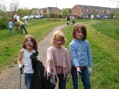 painted faces pick up litter